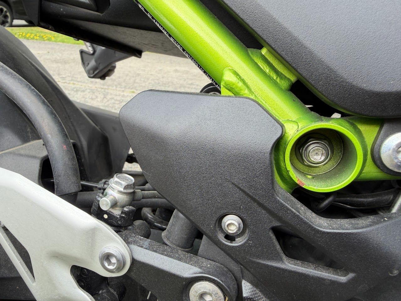 Motorcycle frame and engine mounting area inspected during routine storage maintenance